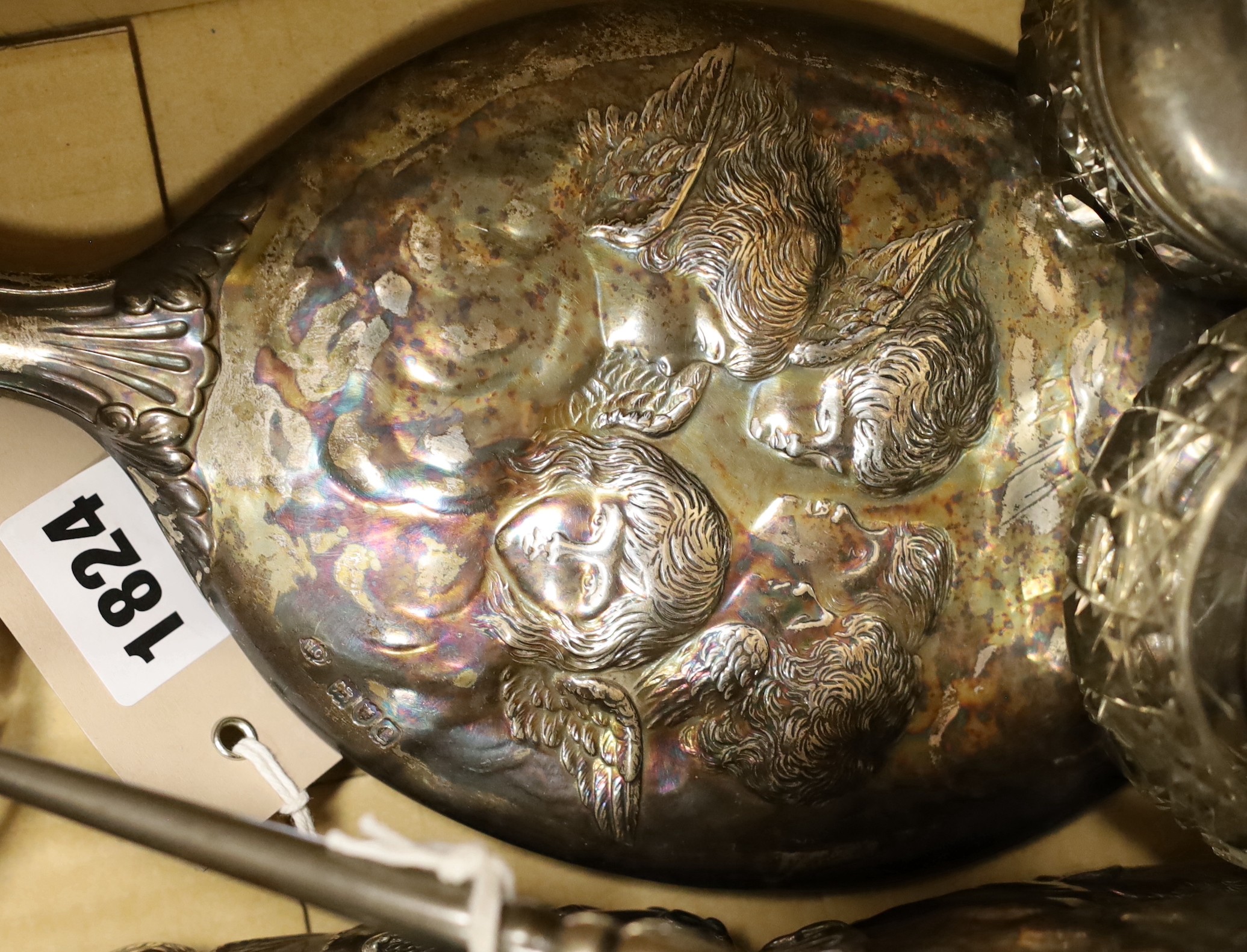 A late Victorian five piece silver Reynolds angel dressing table set, maker William Comyns, four assorted silver lidded glass Reynolds angel toilet jars and sundries